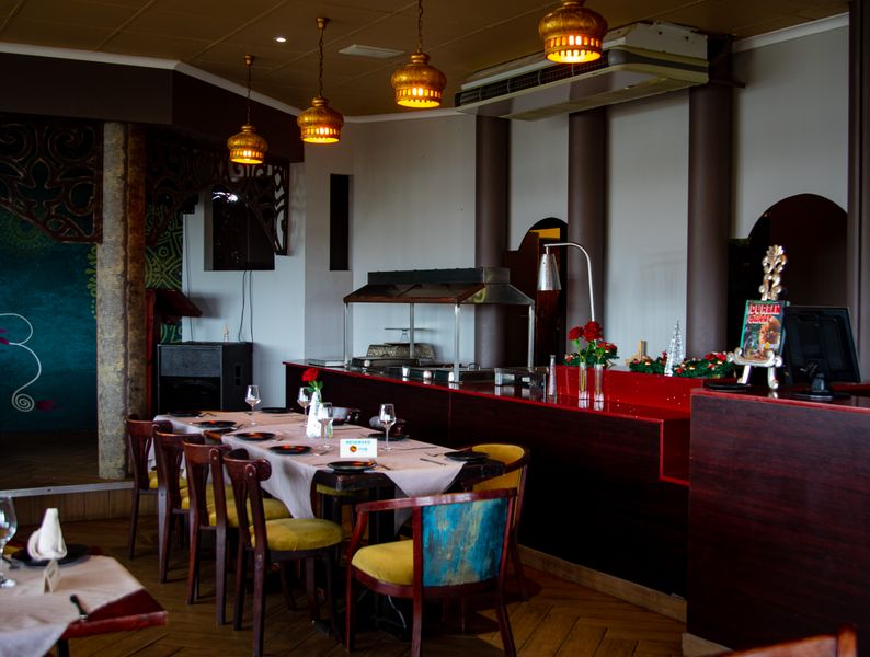 Starbird chicken restaurant interior with warm lighting and modern decor