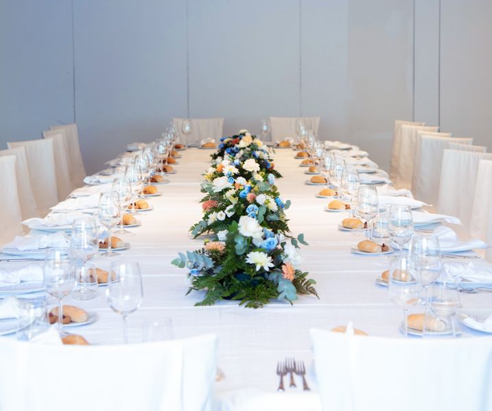 Private dining event with an elegant table setting and food spread