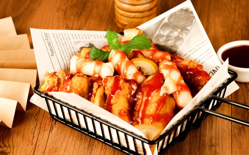 Loaded chicken platter with fries and dipping sauces
